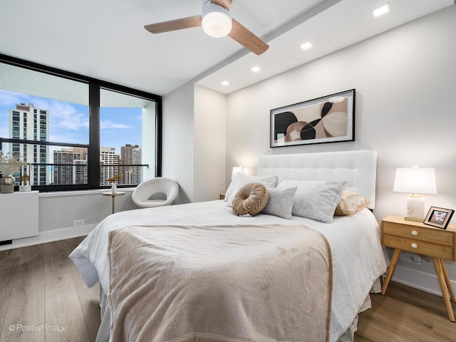 bedroom featuring ceiling fan and dark wood-type flooring