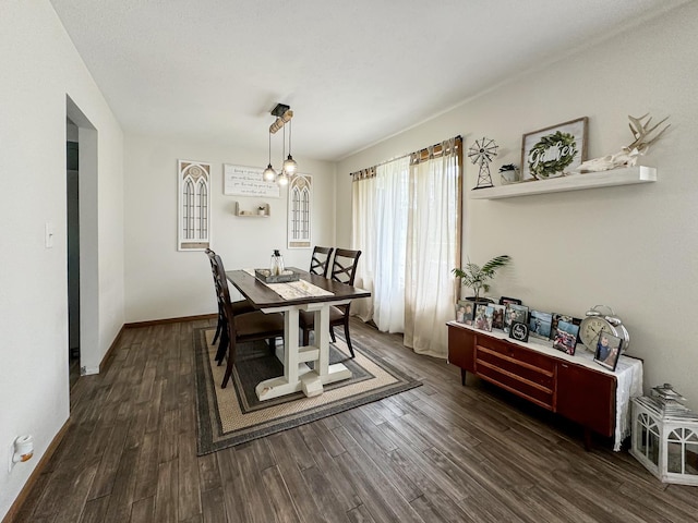 dining area with dark hardwood / wood-style flooring