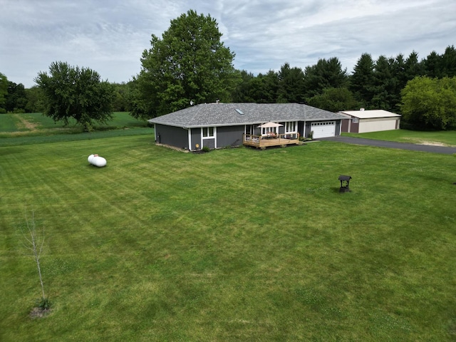 view of front of house with a deck and a front lawn