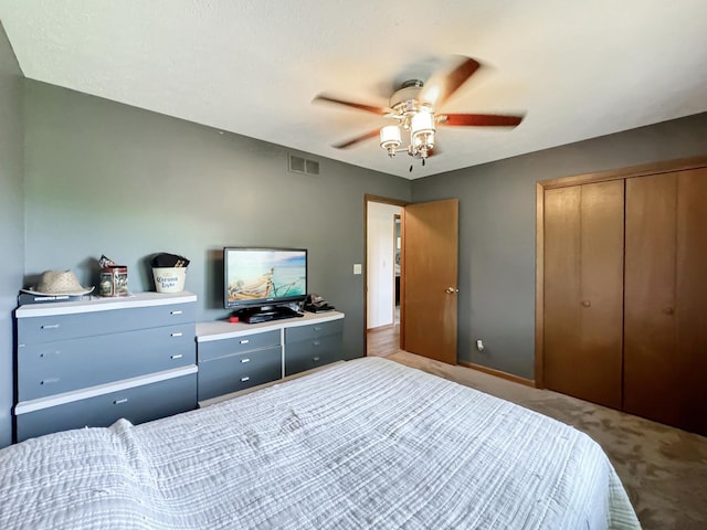 bedroom with carpet flooring, a closet, and ceiling fan