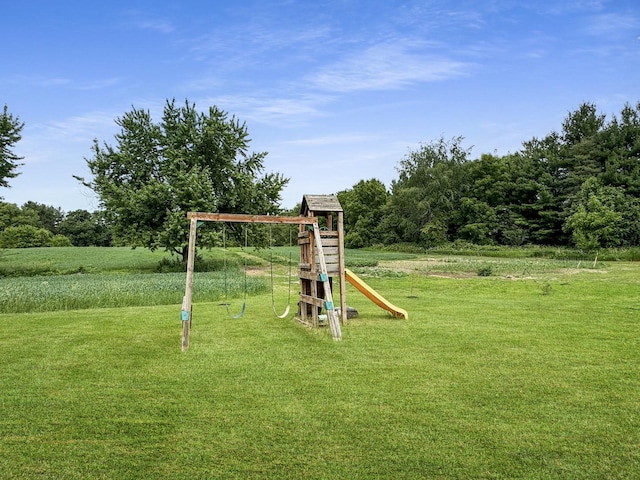 view of jungle gym featuring a lawn