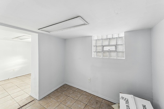 unfurnished room featuring light tile patterned floors