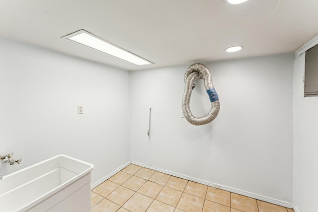 laundry area featuring light tile patterned flooring