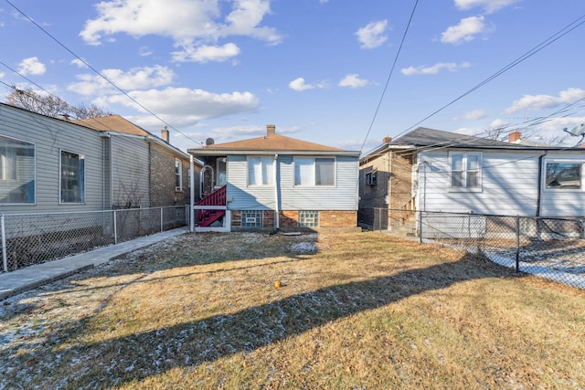 back of house with a yard