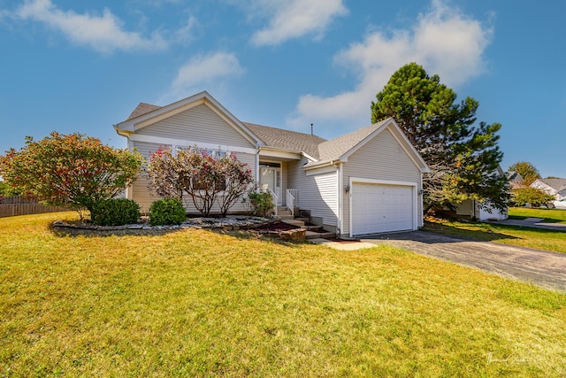 view of front of house with a front lawn and a garage