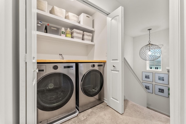 washroom featuring washer and clothes dryer