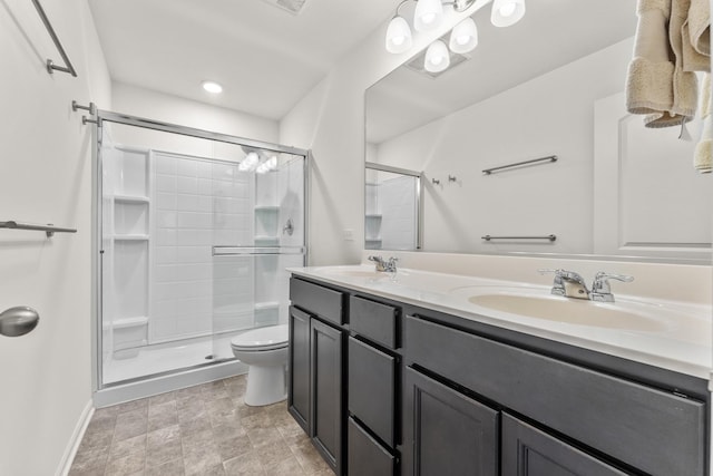 bathroom with vanity, an enclosed shower, and toilet