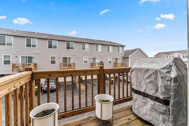 wooden deck featuring grilling area