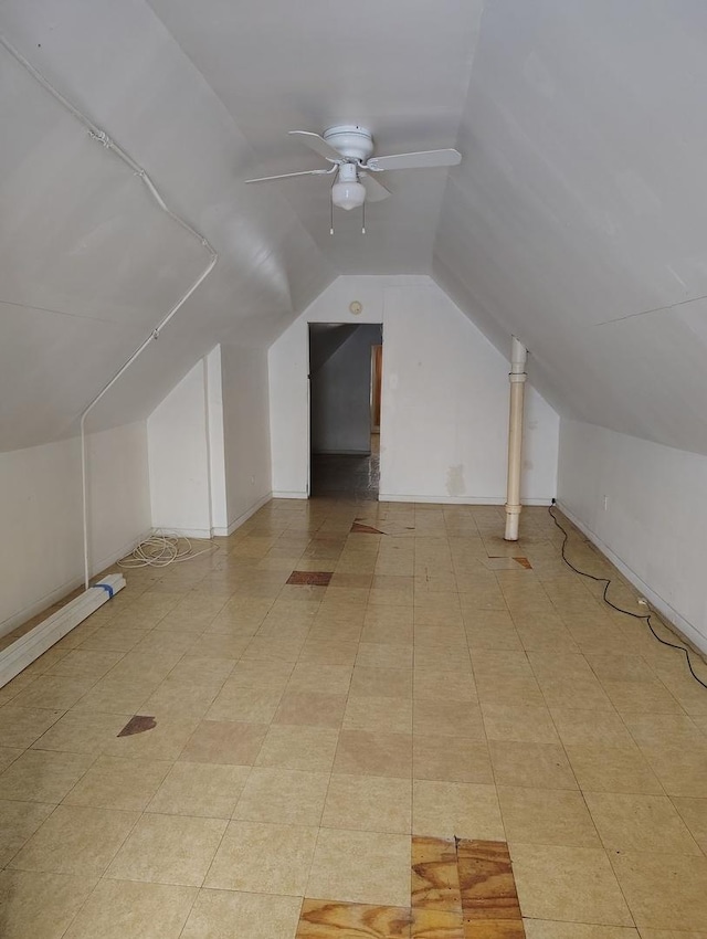 bonus room with ceiling fan and vaulted ceiling