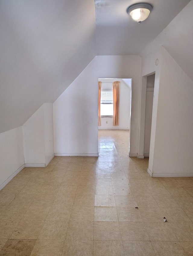 additional living space with vaulted ceiling