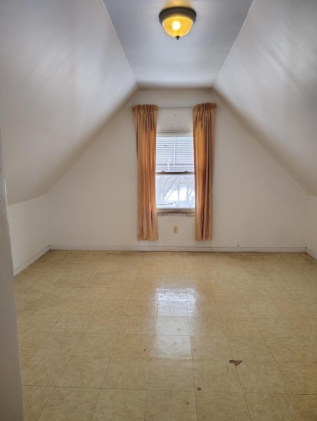 additional living space with lofted ceiling