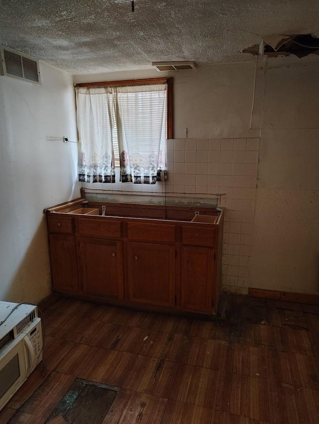 kitchen featuring a textured ceiling