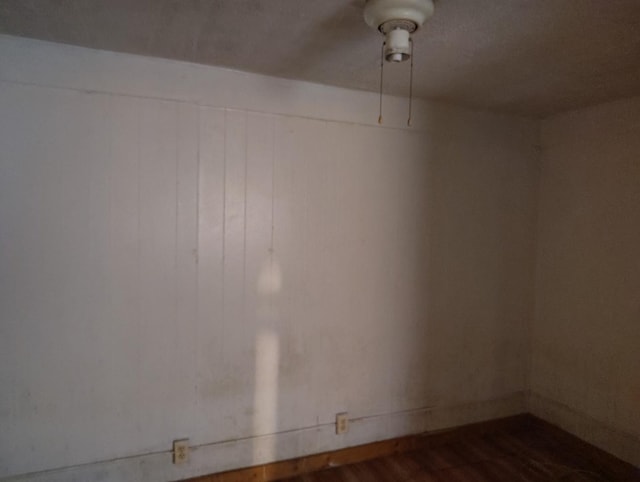 unfurnished room featuring dark hardwood / wood-style floors