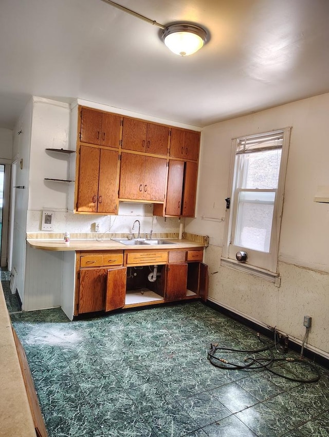 kitchen with tasteful backsplash and sink