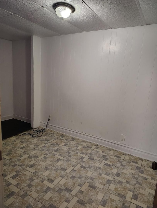 empty room with wooden walls