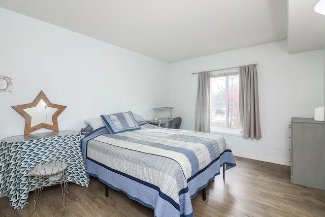 bedroom with wood-type flooring