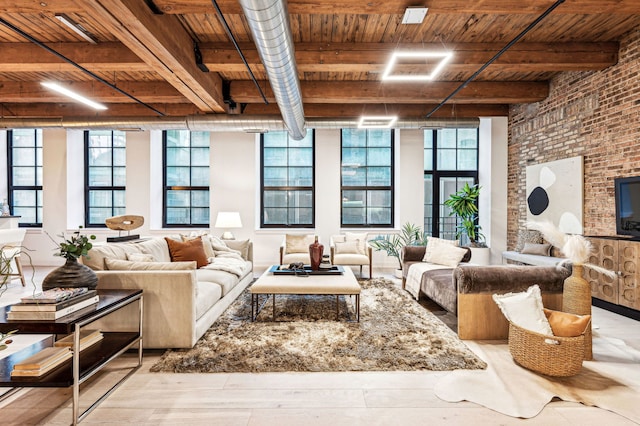 living room featuring beam ceiling, wood ceiling, brick wall, and light hardwood / wood-style flooring