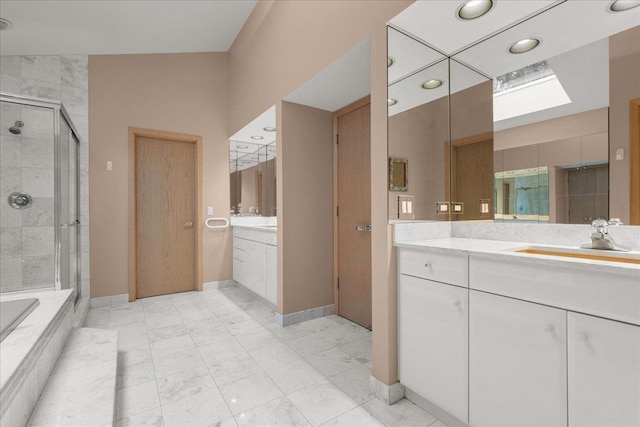 bathroom with vanity and a shower with shower door