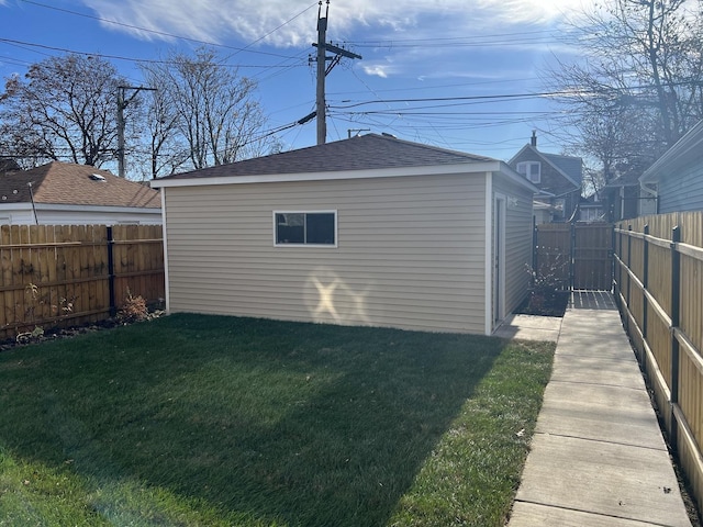 view of outbuilding featuring a yard