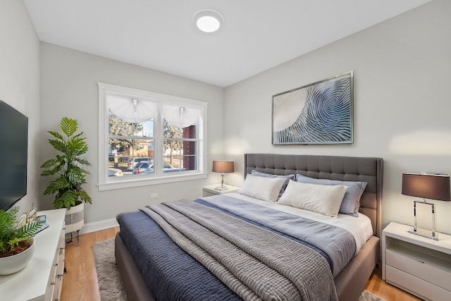 bedroom with light hardwood / wood-style floors