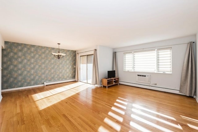 unfurnished living room with baseboard heating, light hardwood / wood-style flooring, and an AC wall unit