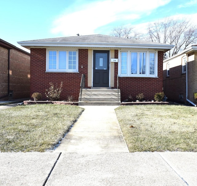 bungalow-style house with a front yard