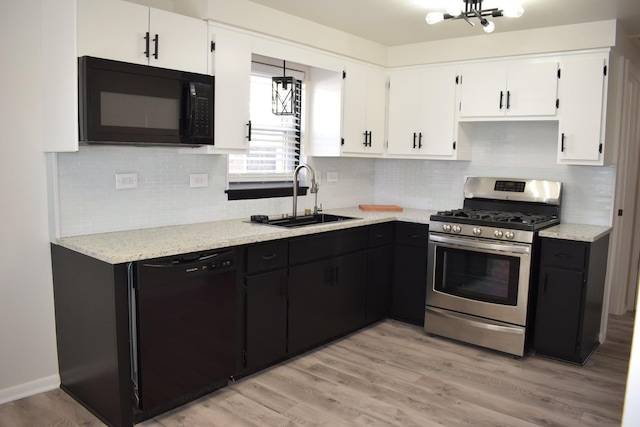 kitchen featuring light hardwood / wood-style flooring, white cabinets, black appliances, and sink