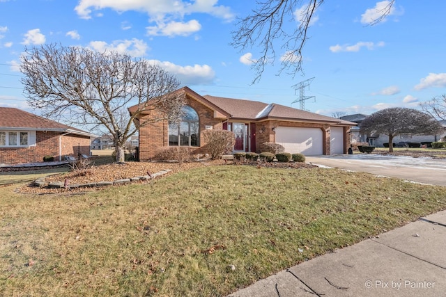 single story home with a front yard and a garage