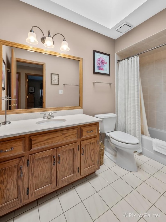 full bathroom with toilet, shower / bath combo, vanity, and tile patterned floors