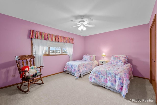 carpeted bedroom with a closet and ceiling fan