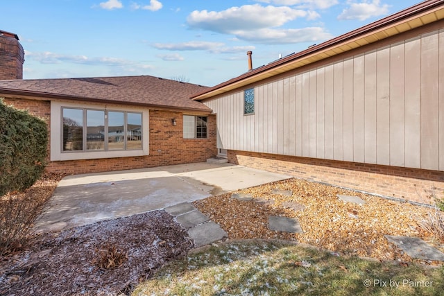 back of house with a patio