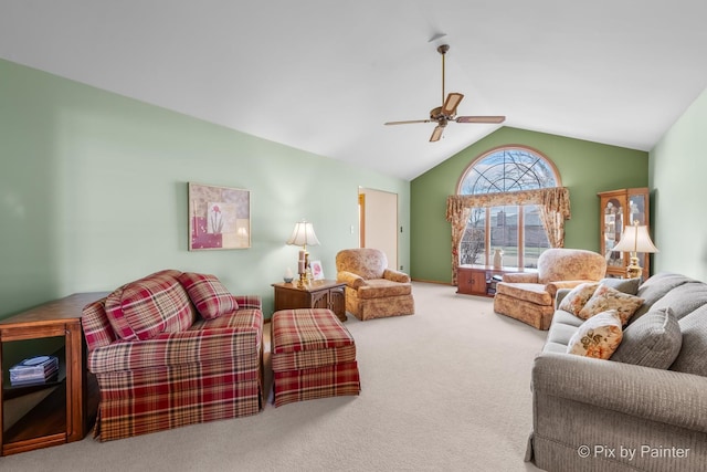 living room with ceiling fan, lofted ceiling, and carpet floors