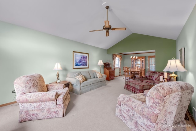 carpeted living room with ceiling fan with notable chandelier and lofted ceiling