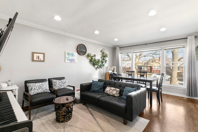 living room with wood-type flooring and crown molding