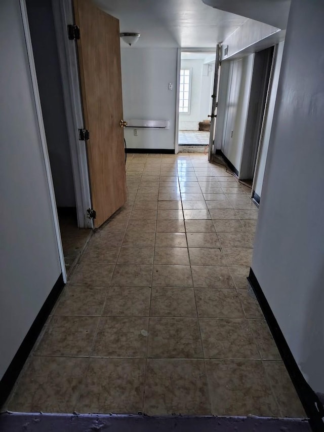 corridor with tile patterned floors