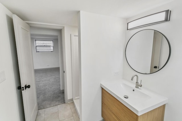 bathroom with tile patterned flooring and vanity