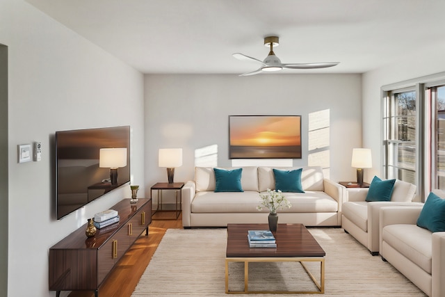 living room featuring ceiling fan and light wood-type flooring