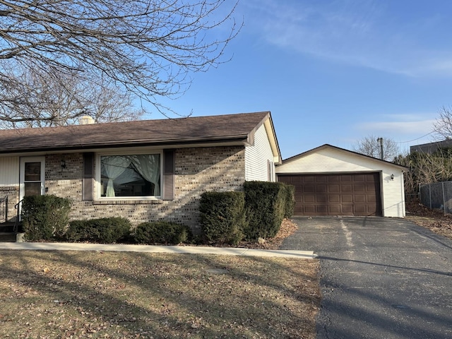 view of front of property featuring an outbuilding and a garage