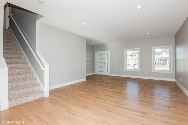 unfurnished living room featuring light hardwood / wood-style floors