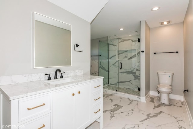 bathroom featuring vanity, walk in shower, and toilet