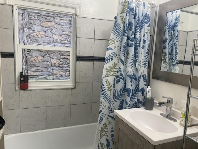 bathroom featuring vanity and shower / tub combo