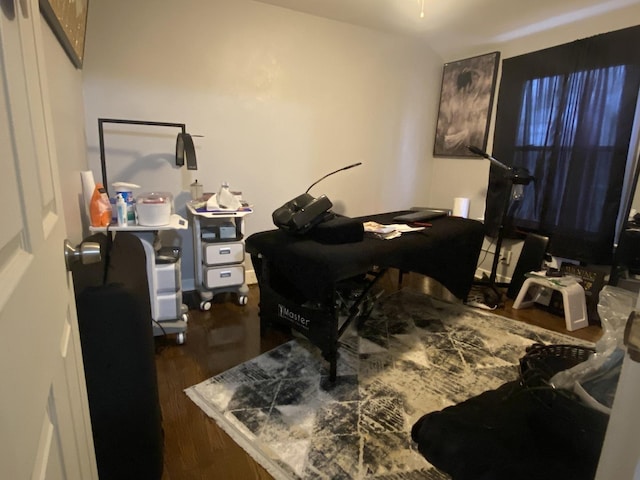 office space with dark wood-type flooring