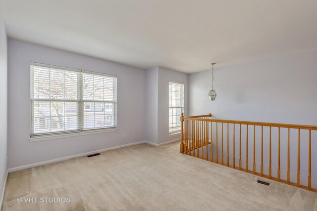 unfurnished bedroom with light wood-type flooring, ceiling fan, a spacious closet, and a closet