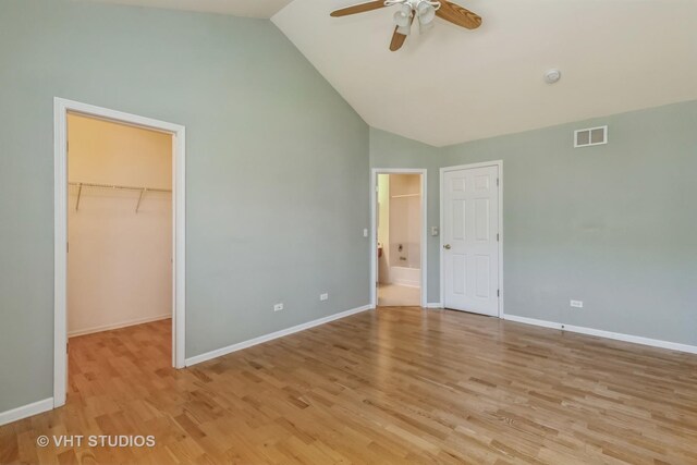 full bathroom with toilet, plus walk in shower, and vanity