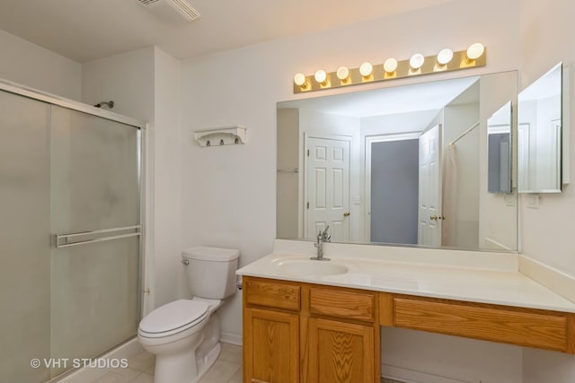 bathroom with vanity, an enclosed shower, tile patterned floors, and toilet