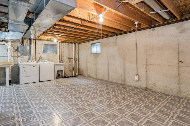 basement with washing machine and clothes dryer