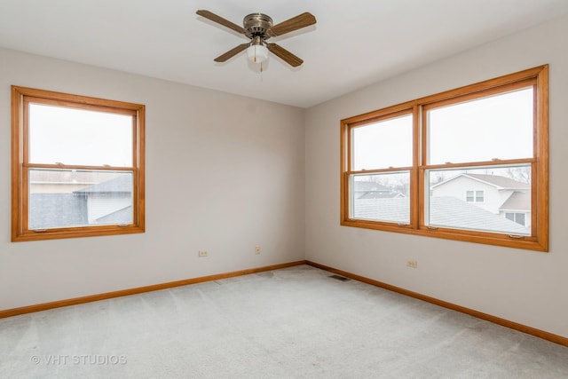 carpeted empty room with ceiling fan