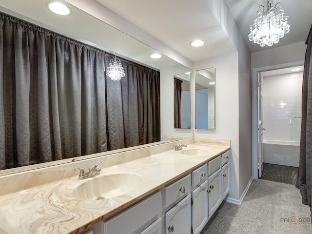 bathroom featuring a chandelier and vanity