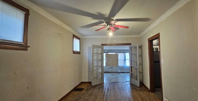 corridor featuring dark hardwood / wood-style floors, baseboard heating, crown molding, and french doors