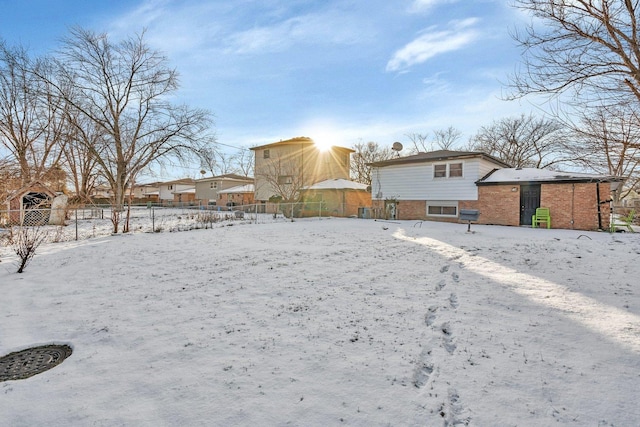 view of yard layered in snow